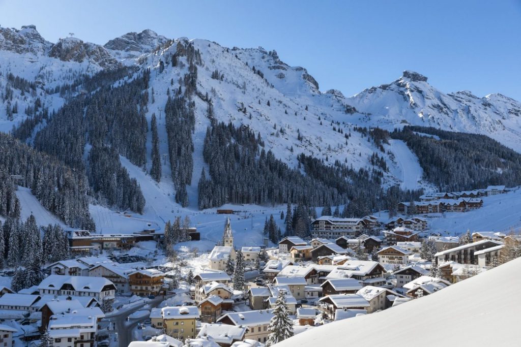 Image taken over the ski resort of Arabba with mountains in the background. Arabba is a top destination of some of the best restaurants in the Dolomites 