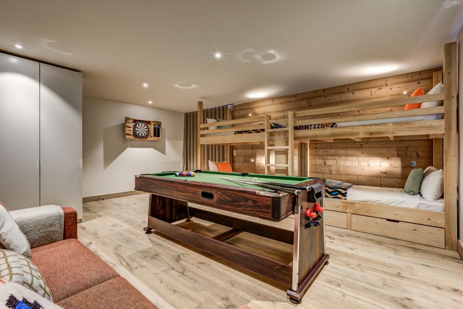 Children's bunk room featuring a sofa, pool table and dart board in Chalet Constantia.