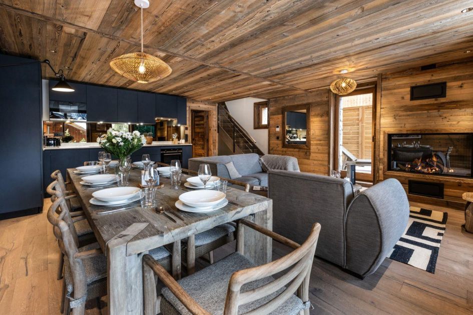 Falcon Lodge F12's contemporary open-plan living space, decorated in alpine woods and royal colours.