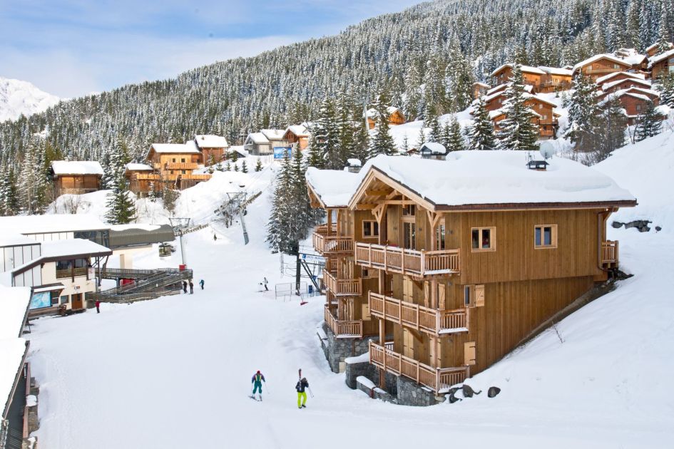 External of Chalet Becca showing its ski-in, ski-out location in La Tania. One of the best family ski chalets in the Three Valleys. 