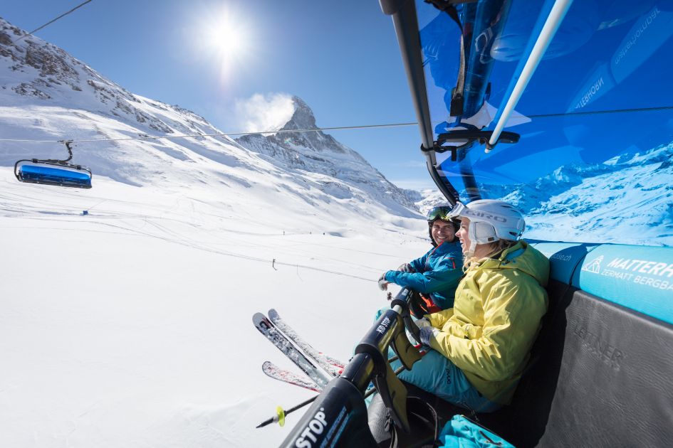 Skiers riding a chairlift in the Matterhorn Ski Paradise in Zermatt.