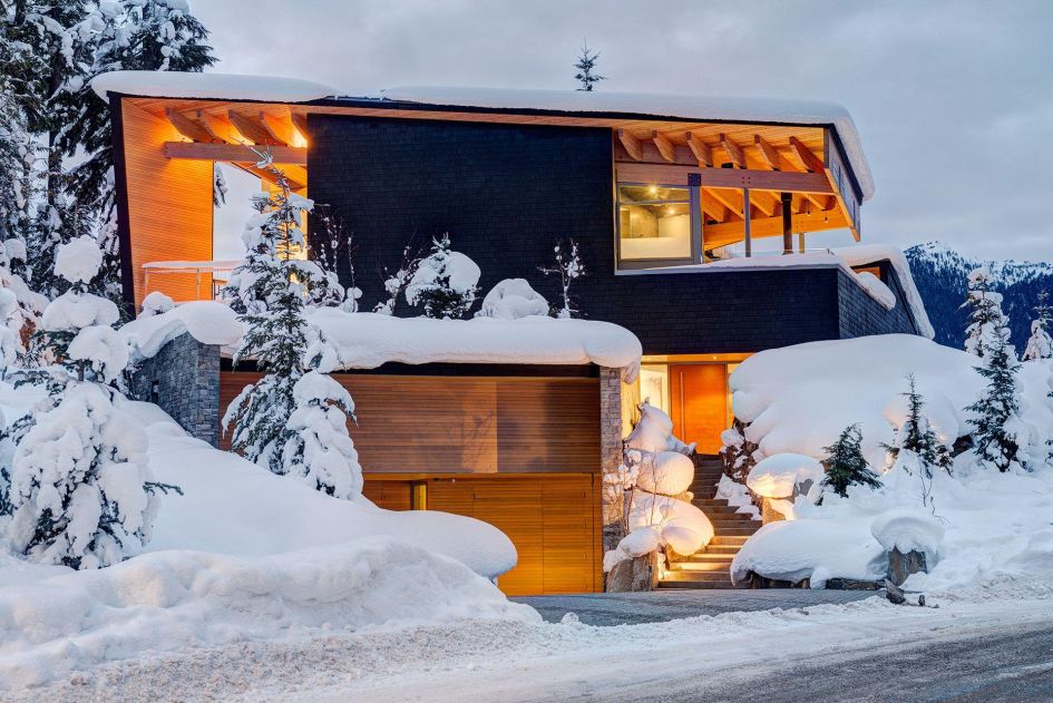 Exterior of High Point Villa in the evening surrounded by snow 