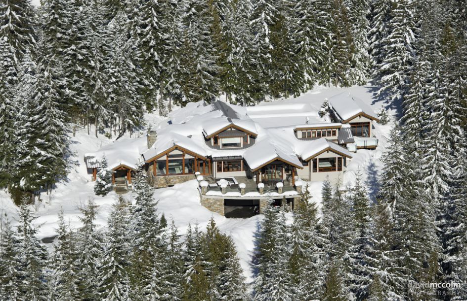 Luxury chalet in Whistler surrounded by a winter wonderland scene