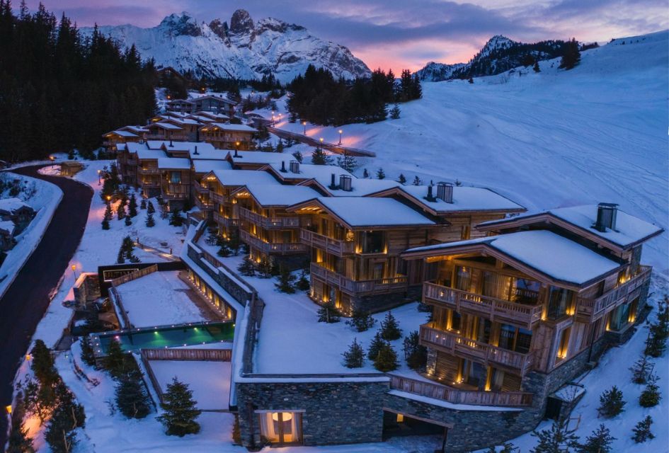 The exterior of the ski-in, ski-out chalet complex Ultima Courchevel, featuring Ultima 4BR, ideal luxury corporate ski chalets.