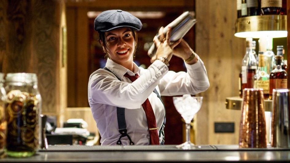 A bartender shaking up a cocktail in Le Bar de Madame, Courchevel 1850.