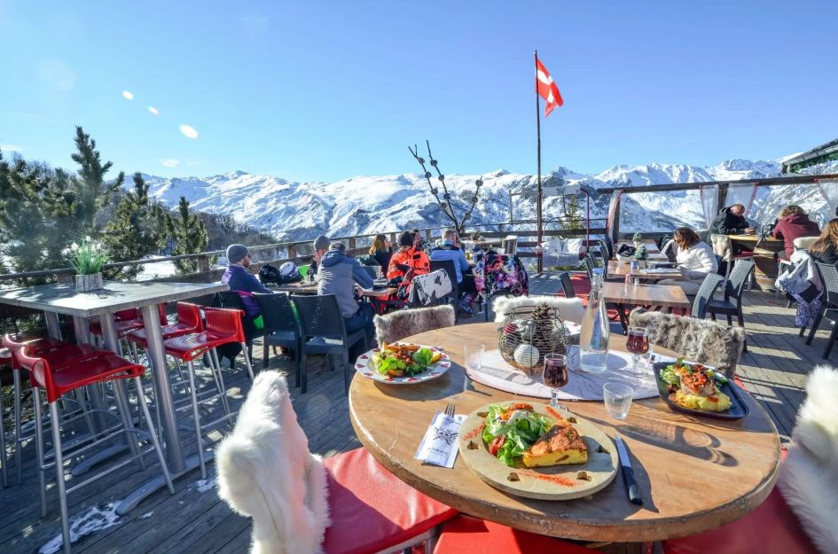 Meal on the terrace of Corbeleys mountain restaurant in St Martin de Belleville.