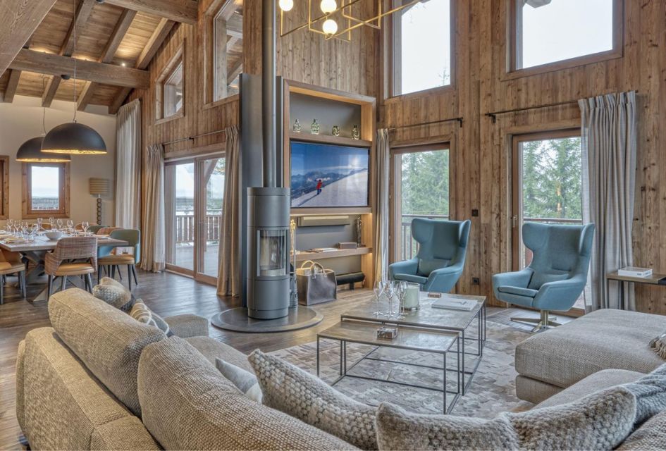 Chalet Divinity's plush, open-plan living and dining area, stylishly decorated and well-suited to a corporate skiing group.