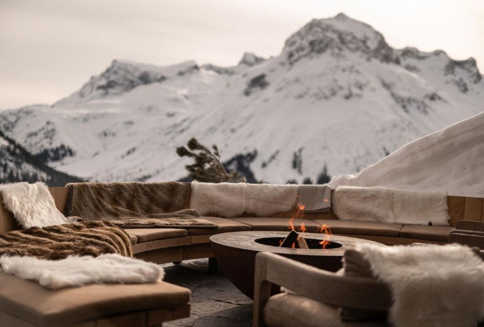 The firepit on the terrace of The Barn, a luxury ski chalet in Lech! With the snowy Arlberg backdrop, this chalet has to be on your luxury ski holiday checklist.