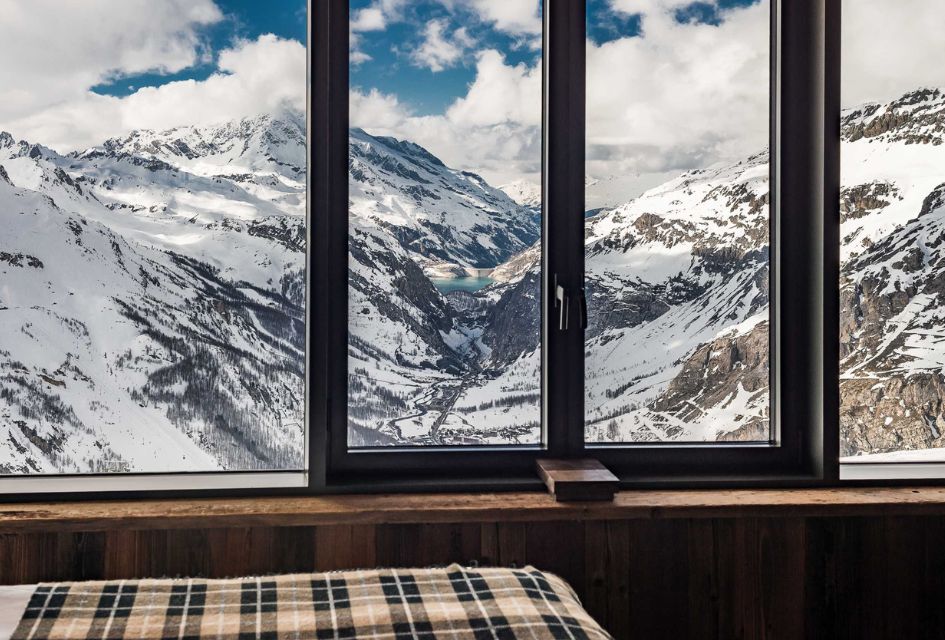 View overlooking the Val d'Isère valley from Penthouse Charvet's luxury chalet bedroom in the Refuge de Solaise.