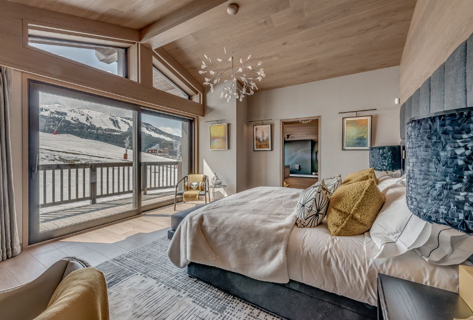 Looking out on the Belvédère piste in Courchevel Moriond from Chalet Bacchus' luxury chalet bedroom.