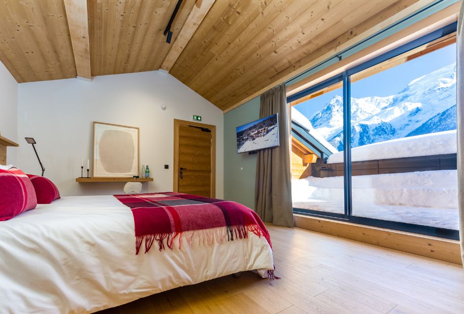 View of snowy Mont Blanc from the luxury chalet bedroom of Le Chalet Mont Blanc in Chamonix.