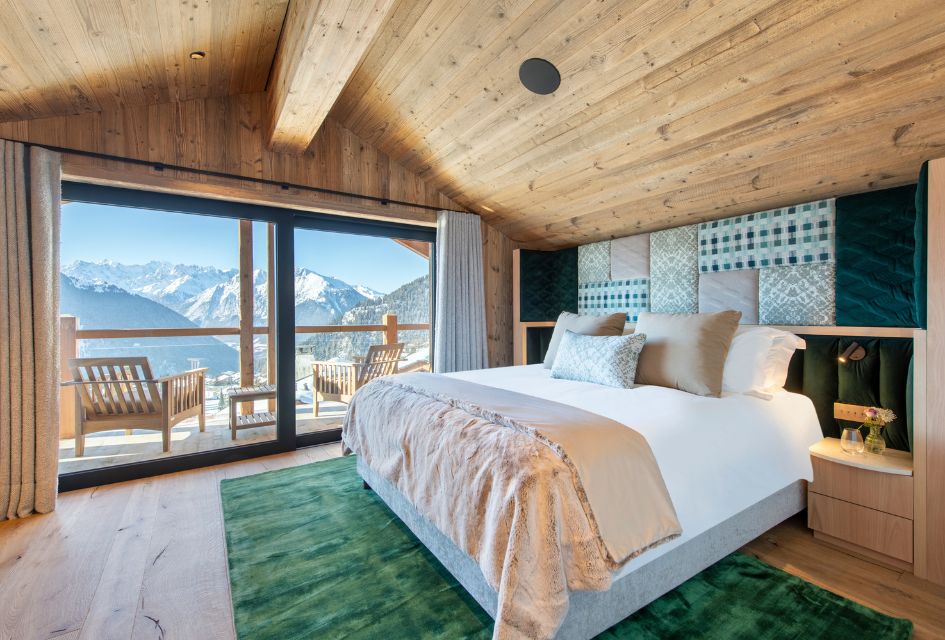 Looking out on the Verbier valley from the luxury chalet bedroom of Chalet Kitsilano.